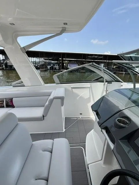Slide: The Image of The image shows the cockpit of a 2021 Aviara AV32 with modern seating and controls. - 25