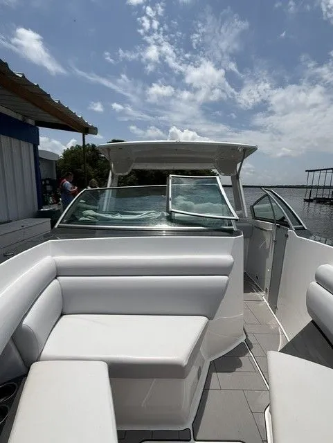 Slide: The Image of The image shows the cockpit of a 2021 Aviara AV32 with white upholstered seating. - 28