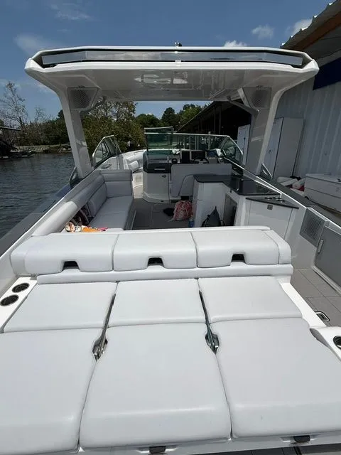 Slide: The Image of The image shows a 2021 Aviara AV32 with luxurious white seating and a modern design. - 16