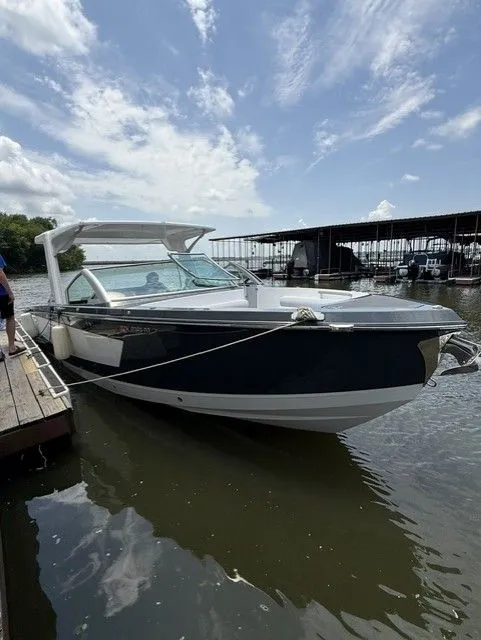 Slide: The Image of A 2021 Aviara AV32 boat is docked on the water. - 2