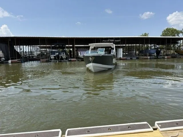 Slide: The Image of Aviara AV32 2021 on the water near a covered dock. - 14