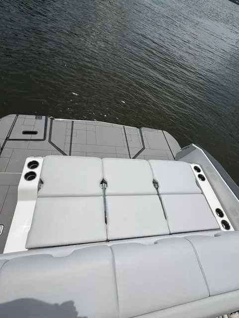 Slide: The Image of The image shows the stern of a 2021 Aviara AV32 boat with gray upholstery. - 19