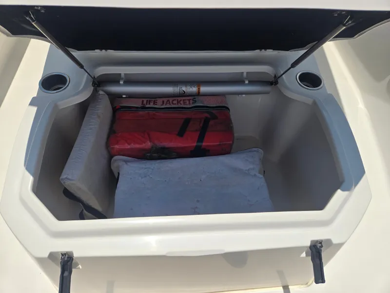 Slide: The Image of An open storage compartment with life jackets and cushions on a boat. - 15