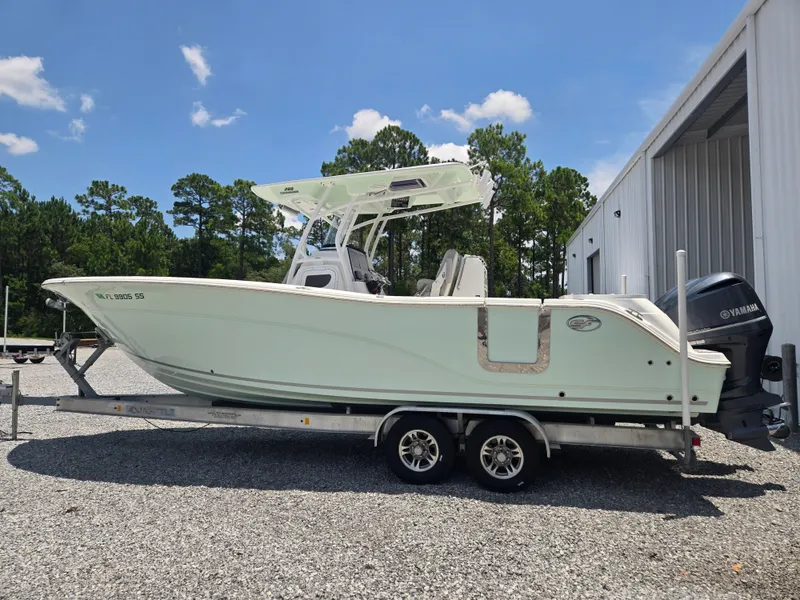 The Image of 2019 Sea Fox 288 Commander on a trailer beside a building. - 0