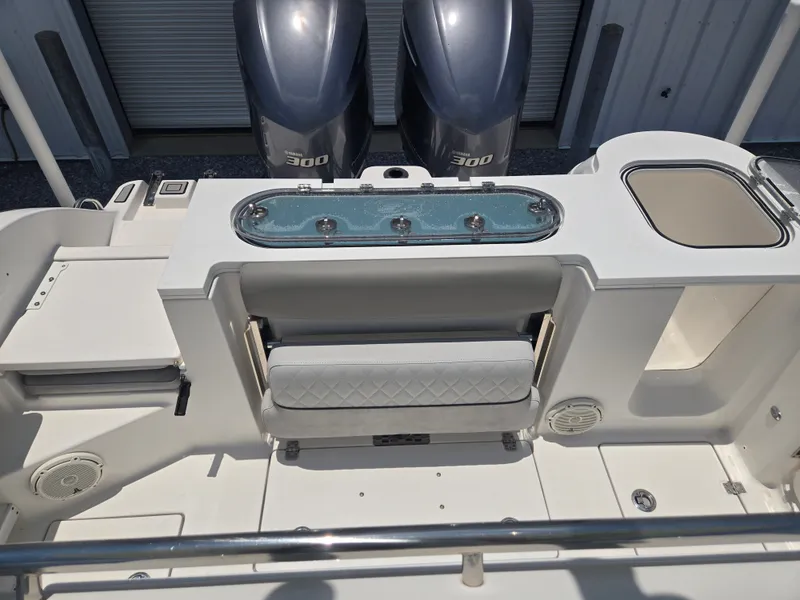 Slide: The Image of The image shows the stern of a Sea Fox 288 Commander boat with two outboard engines. - 8
