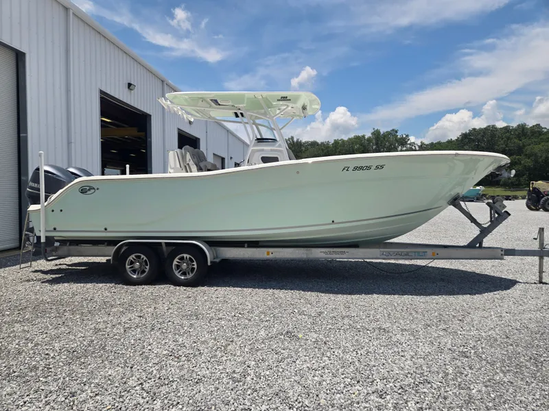 Slide: The Image of A 2019 Sea Fox 288 Commander on a trailer in front of a building. - 3
