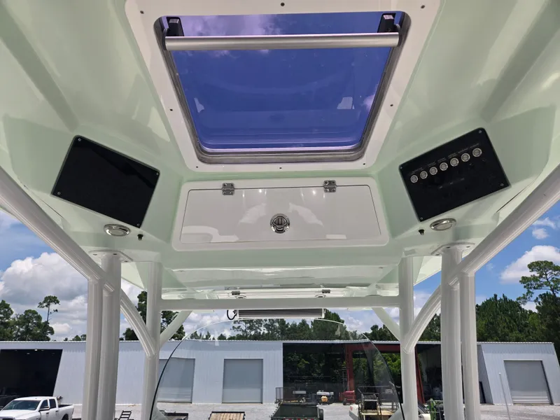 Slide: The Image of View of a boat's roof with a blue skylight and control panels. - 6