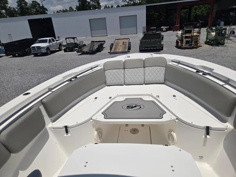 Slide: The Image of The image shows the bow area of a Sea Fox 288 Commander boat with gray upholstery. - 10