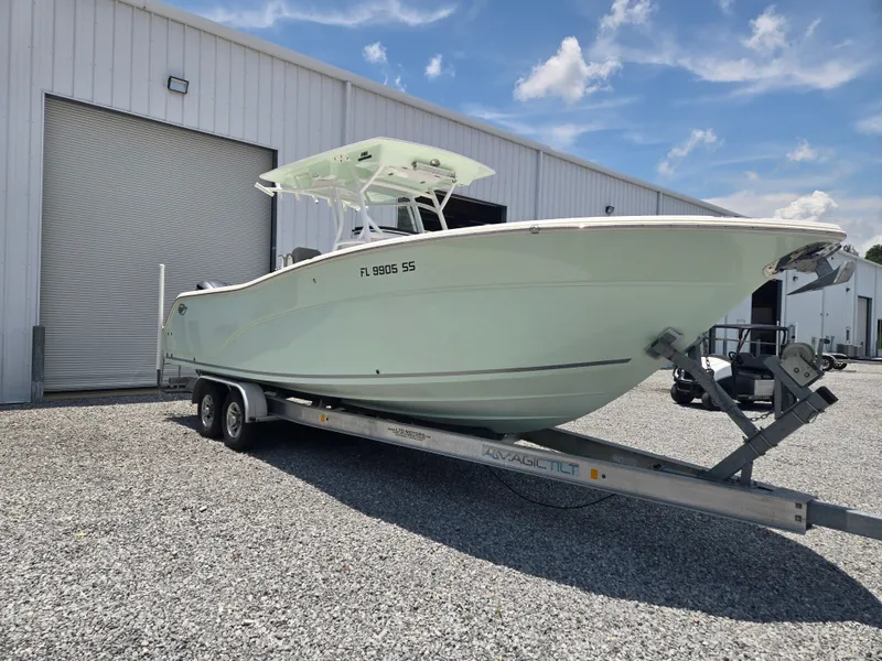 Slide: The Image of A 2019 Sea Fox 288 Commander on a trailer in front of a warehouse building. - 2
