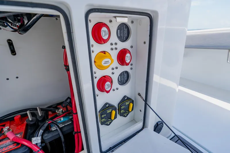 Slide: The Image of Electrical panel of 2021 Costa Custom Boats 264HC, featuring switches and wiring components. - 70