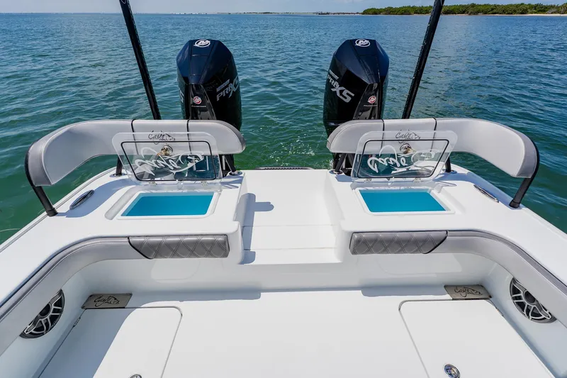 Slide: The Image of 2021 Costa Custom Boats 264HC with dual engines on calm water. - 93