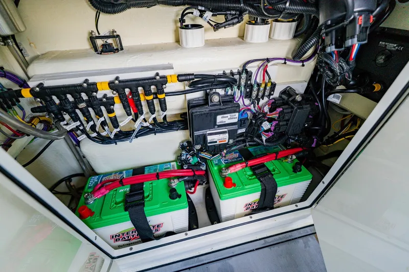 Slide: The Image of Electrical system and batteries inside a 2021 Costa Custom Boats 264HC. - 52