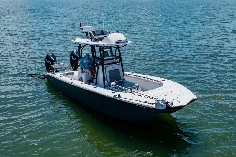 Slide: The Image of 2021 Costa Custom Boats 264HC on calm water, featuring dual engines and modern design. - 17