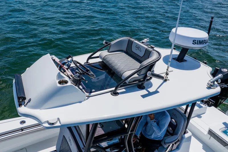 Slide: The Image of 2021 Costa Custom Boats 264HC with elevated helm station on open water. - 25