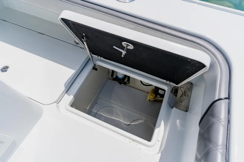 Slide: The Image of Open storage compartment on a 2021 Costa Custom Boats 264HC. - 94
