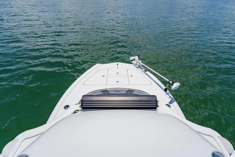 Slide: The Image of Bow view of 2021 Costa Custom Boats 264HC on calm water. - 83