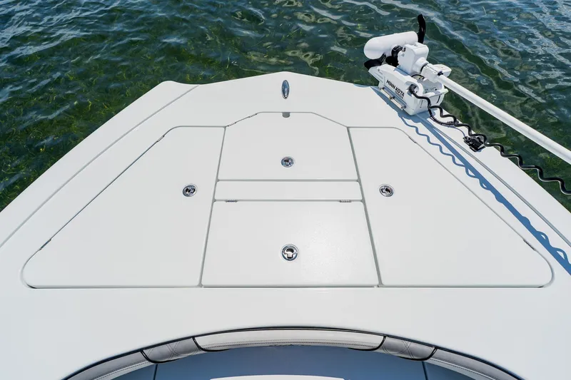 Slide: The Image of Bow view of 2021 Costa Custom Boats 264HC on water, featuring sleek deck design. - 30