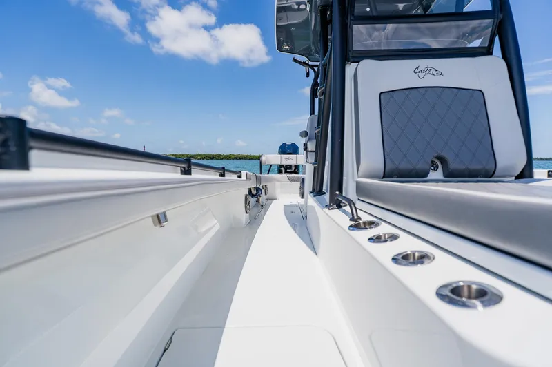Slide: The Image of 2021 Costa Custom Boats 264HC interior, showcasing sleek design and modern features under a clear blue sky. - 47