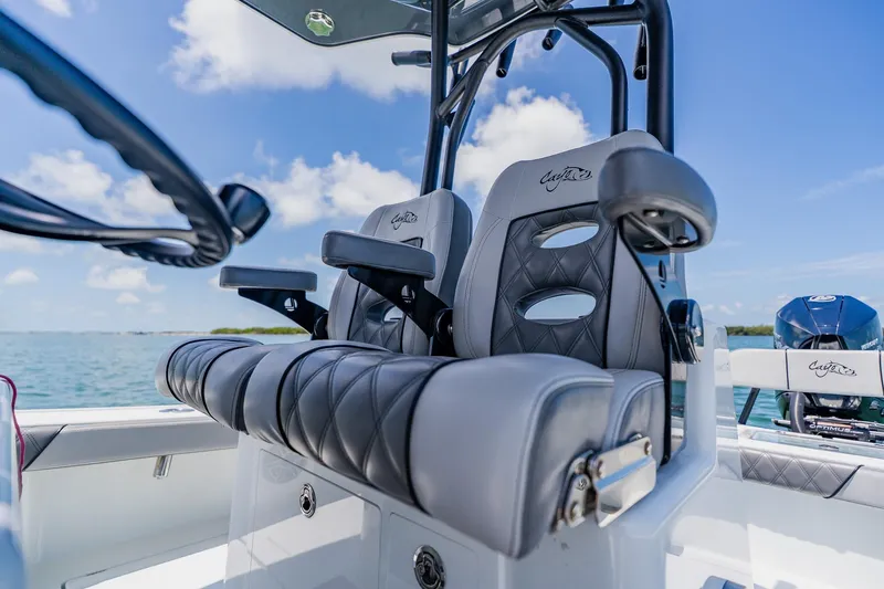 Slide: The Image of Luxury seating on 2021 Costa Custom Boats 264HC, featuring sleek design and ocean backdrop. - 65