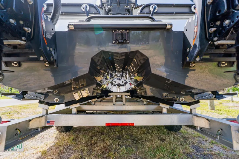 Slide: The Image of Underneath view of a 2021 Costa Custom Boats 264HC on a trailer. - 3