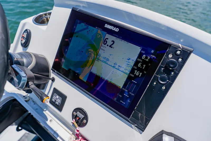 Slide: The Image of Simrad display on 2021 Costa Custom Boats 264HC, showing navigation and depth data. - 82