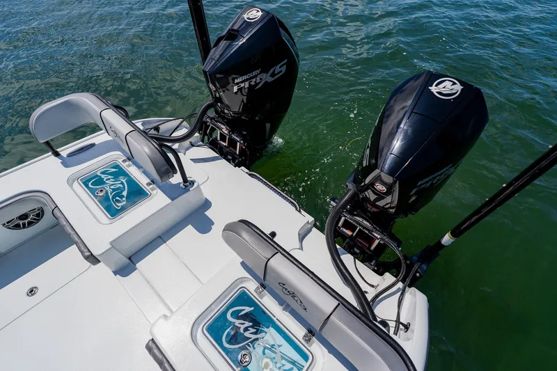 Slide: The Image of 2021 Costa Custom Boats 264HC with dual Mercury engines on water. - 89