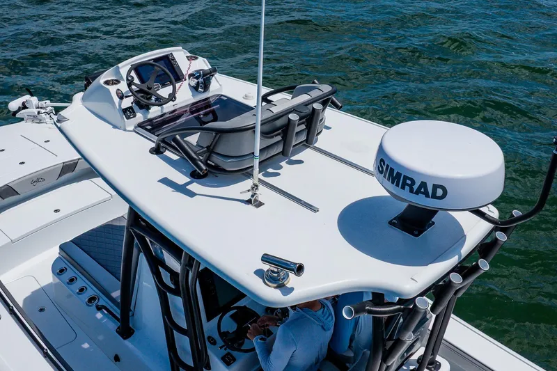 Slide: The Image of 2021 Costa Custom Boats 264HC with advanced navigation equipment on open water. - 26
