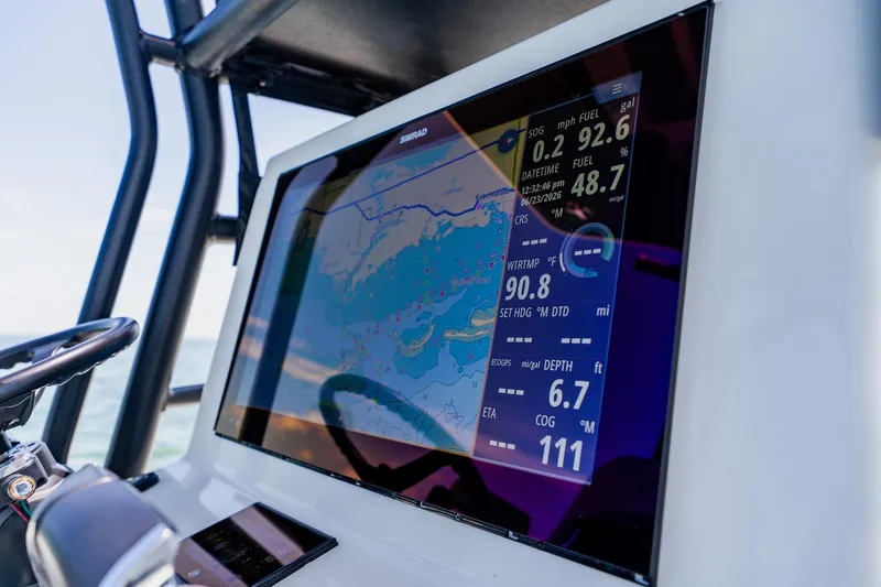 Slide: The Image of Navigation display on 2021 Costa Custom Boats 264HC, showing map and data. - 71
