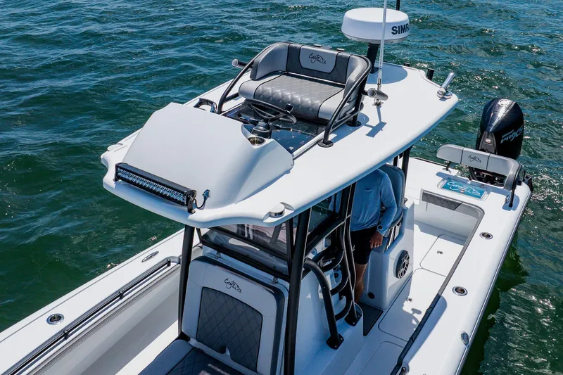 Slide: The Image of 2021 Costa Custom Boats 264HC on water, featuring sleek design and advanced navigation equipment. - 24