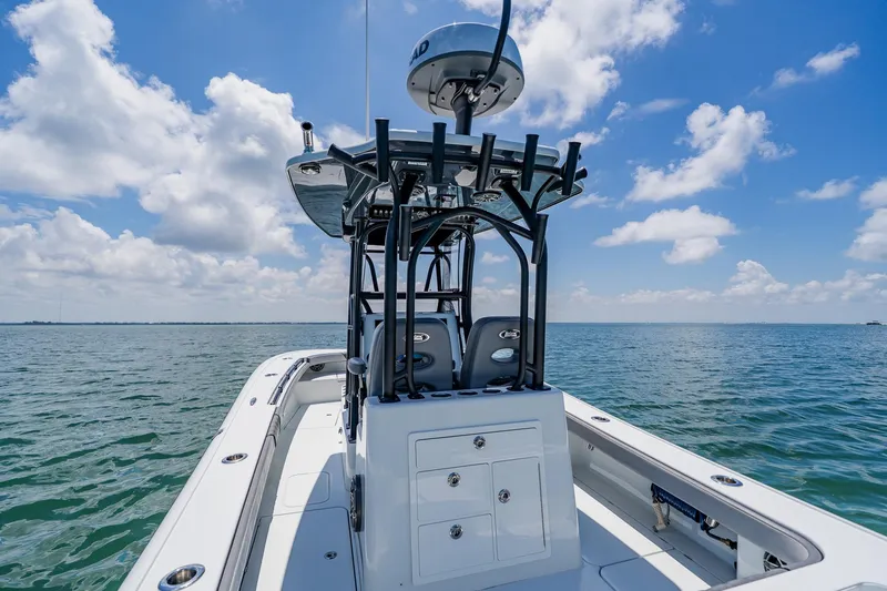 Slide: The Image of 2021 Costa Custom Boats 264HC on open water under a clear blue sky. - 57