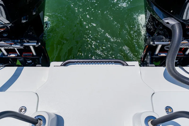 Slide: The Image of Rear view of 2021 Costa Custom Boats 264HC with dual engines on water. - 90