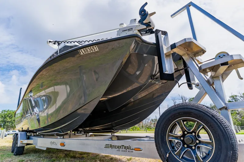 Slide: The Image of 2021 Costa Custom Boats 264HC on trailer, showcasing sleek design and modern features. - 10