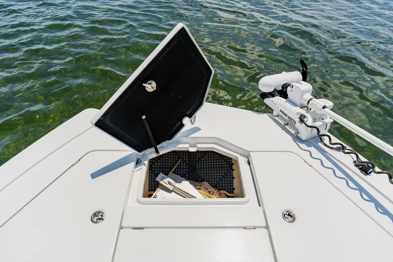 Slide: The Image of 2021 Costa Custom Boats 264HC with open hatch and trolling motor on clear water. - 35