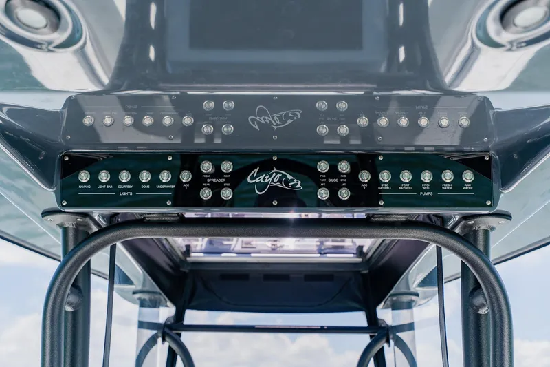 Slide: The Image of Control panel of 2021 Costa Custom Boats 264HC, featuring various switches and controls. - 77