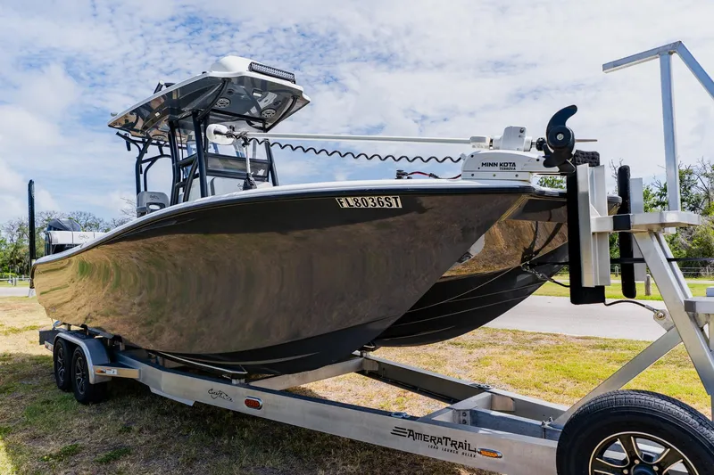 Slide: The Image of 2021 Costa Custom Boats 264HC on trailer, featuring sleek design and modern equipment. - 9