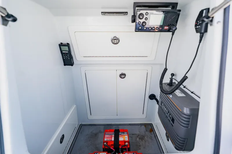 Slide: The Image of Interior of 2021 Costa Custom Boats 264HC with navigation equipment and storage compartments. - 49