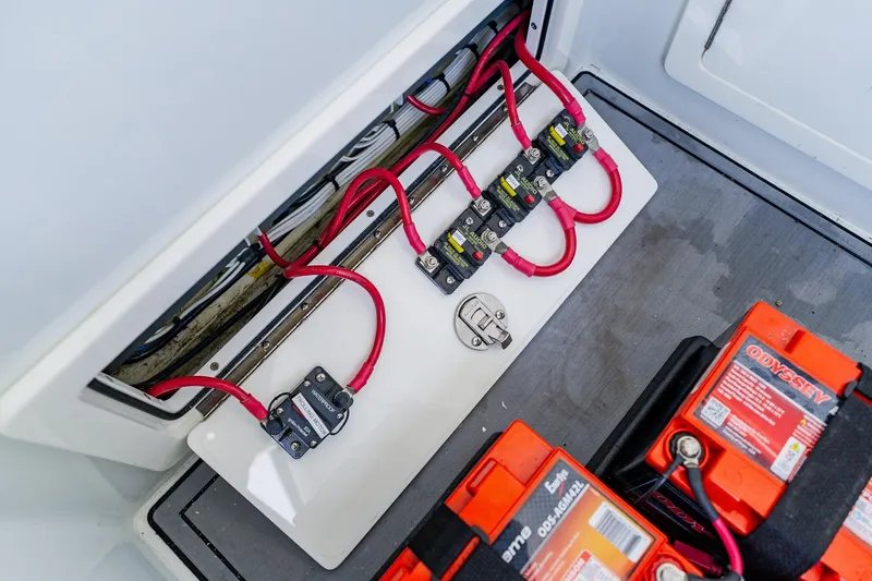 Slide: The Image of Electrical system of 2021 Costa Custom Boats 264HC with batteries and wiring. - 53