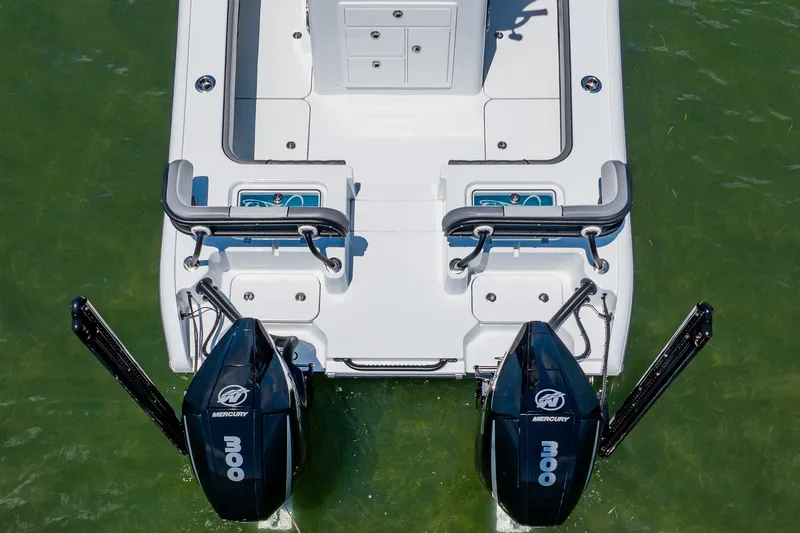 Slide: The Image of 2021 Costa Custom Boats 264HC with dual Mercury outboard engines on green water. - 18