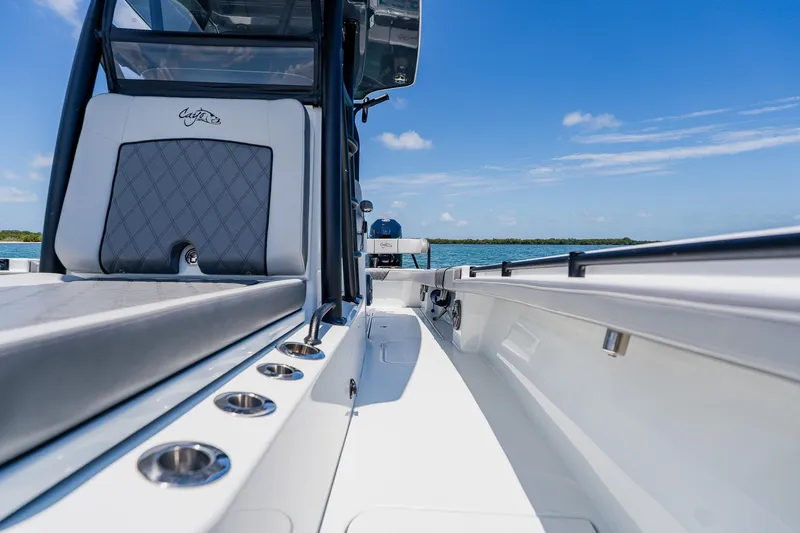 Slide: The Image of Costa Custom Boats 264HC 2021 model, sleek interior view with ocean backdrop. - 48