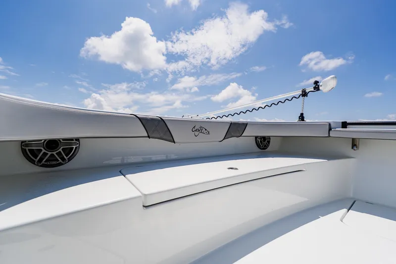 Slide: The Image of 2021 Costa Custom Boats 264HC interior with speakers, clear sky background. - 37