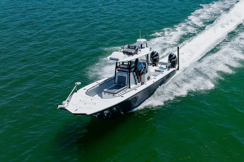Slide: The Image of 2021 Costa Custom Boats 264HC cruising on open water, showcasing sleek design and powerful engines. - 23