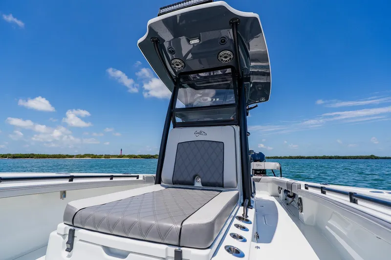 Slide: The Image of 2021 Costa Custom Boats 264HC on water, showcasing sleek design and comfortable seating. - 46