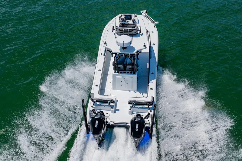 Slide: The Image of 2021 Costa Custom Boats 264HC cruising on open water, rear view. - 21