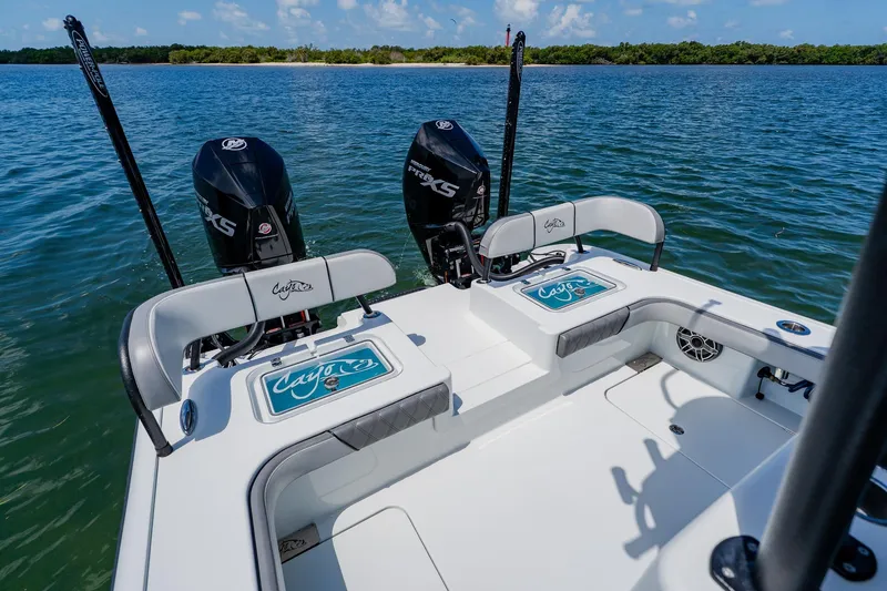 Slide: The Image of 2021 Costa Custom Boats 264HC on water, featuring dual Mercury engines. - 86