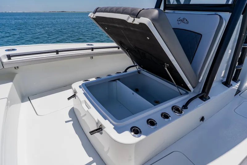 Slide: The Image of 2021 Costa Custom Boats 264HC with open storage compartment on deck, ocean view. - 56