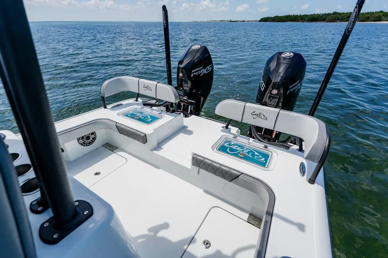 Slide: The Image of 2021 Costa Custom Boats 264HC with dual engines on open water. - 85