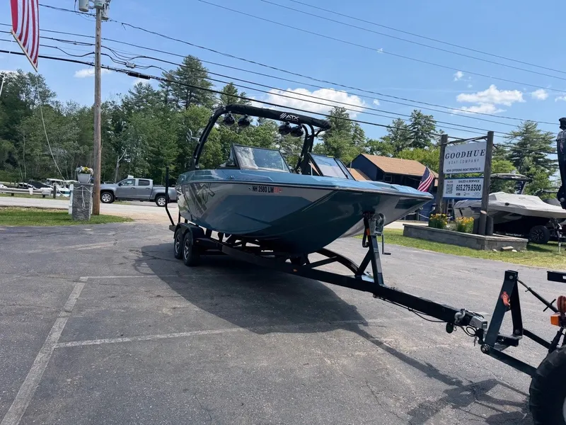 Slide: The Image of A 2021 ATX 22 Type-S boat is on a trailer in a parking lot. - 3