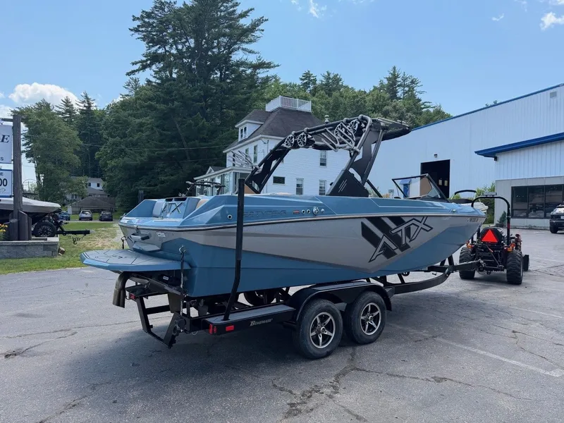 Slide: The Image of A 2021 ATX 22 Type-S boat on a trailer, parked in a lot. - 12