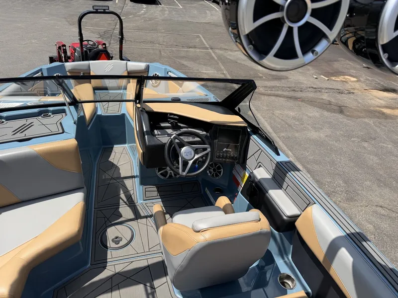 Slide: The Image of The image shows the cockpit of a 2021 ATX 22 Type-S boat with modern seating and electronics. - 16
