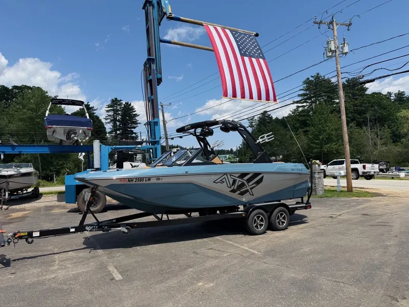 Slide: The Image of A 2021 ATX 22 Type-S boat on a trailer in a parking lot. - 9